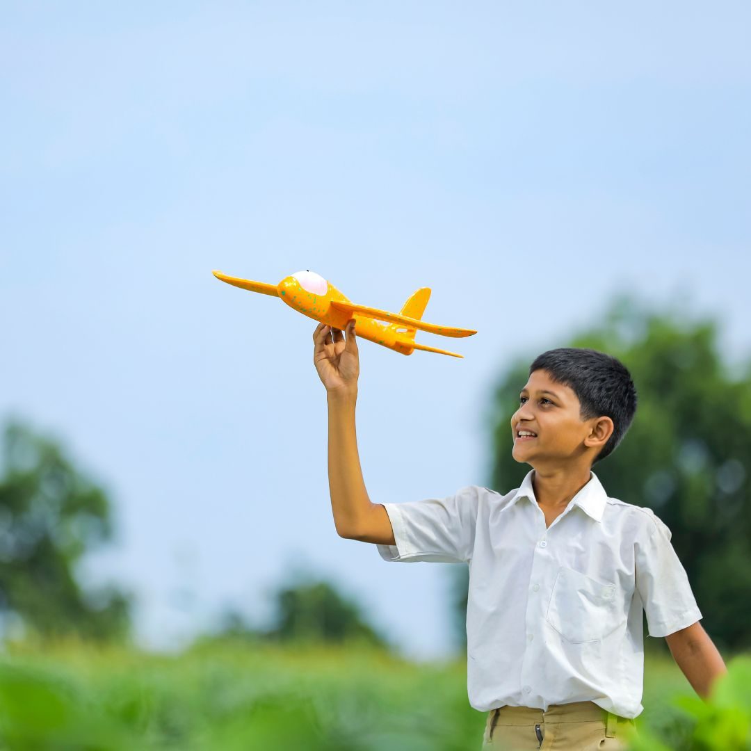 boy flying plane